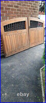Heavy wooden drive way gates with solid steel/iron rails
