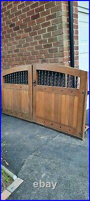 Heavy wooden drive way gates with solid steel/iron rails