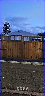 Large wooden driveway gates used