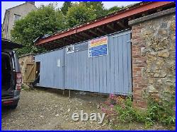 Large wooden driveway gates used