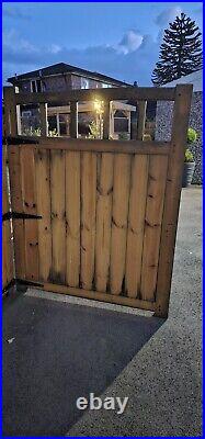 Large wooden driveway gates used