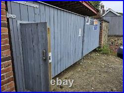 Large wooden driveway gates used