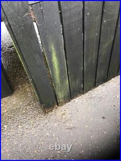 Pair of wooden garden gates with cast iron lugs and closing bracket