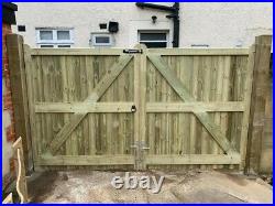 WOODEN TANALISED PAIR OF DRIVEWAY GATE'S WITH IRONMONGERY (grahamxbrown)