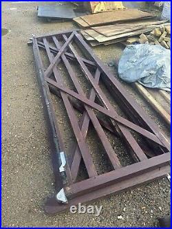 Wooden gates used for driveway. Comes with matching pedestrian gates