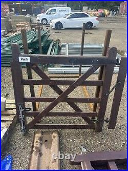 Wooden gates used for driveway. Comes with matching pedestrian gates