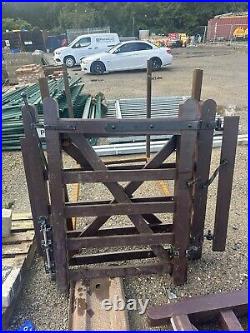 Wooden gates used for driveway. Comes with matching pedestrian gates